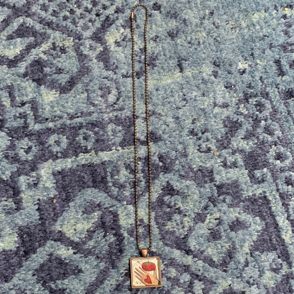 22” aged copper tone dog tag chain w 1” hand w tomato square pendant